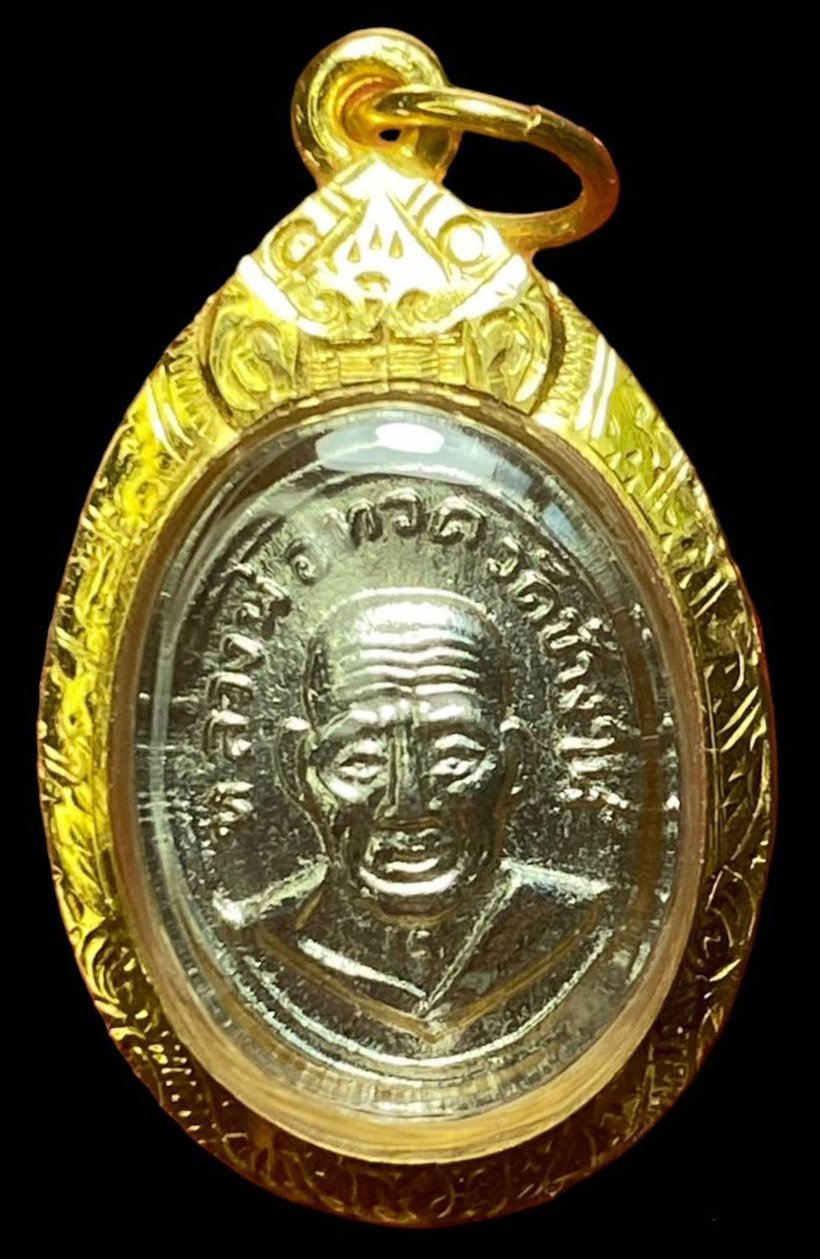 301545 พระเม็ดแตงหลวงปู่ทวด  วัดช้างให้ ปี 2506  เนื้ออัลปาก้า  หน้าผาก 4 เส้น  จ.ปัตตานี 